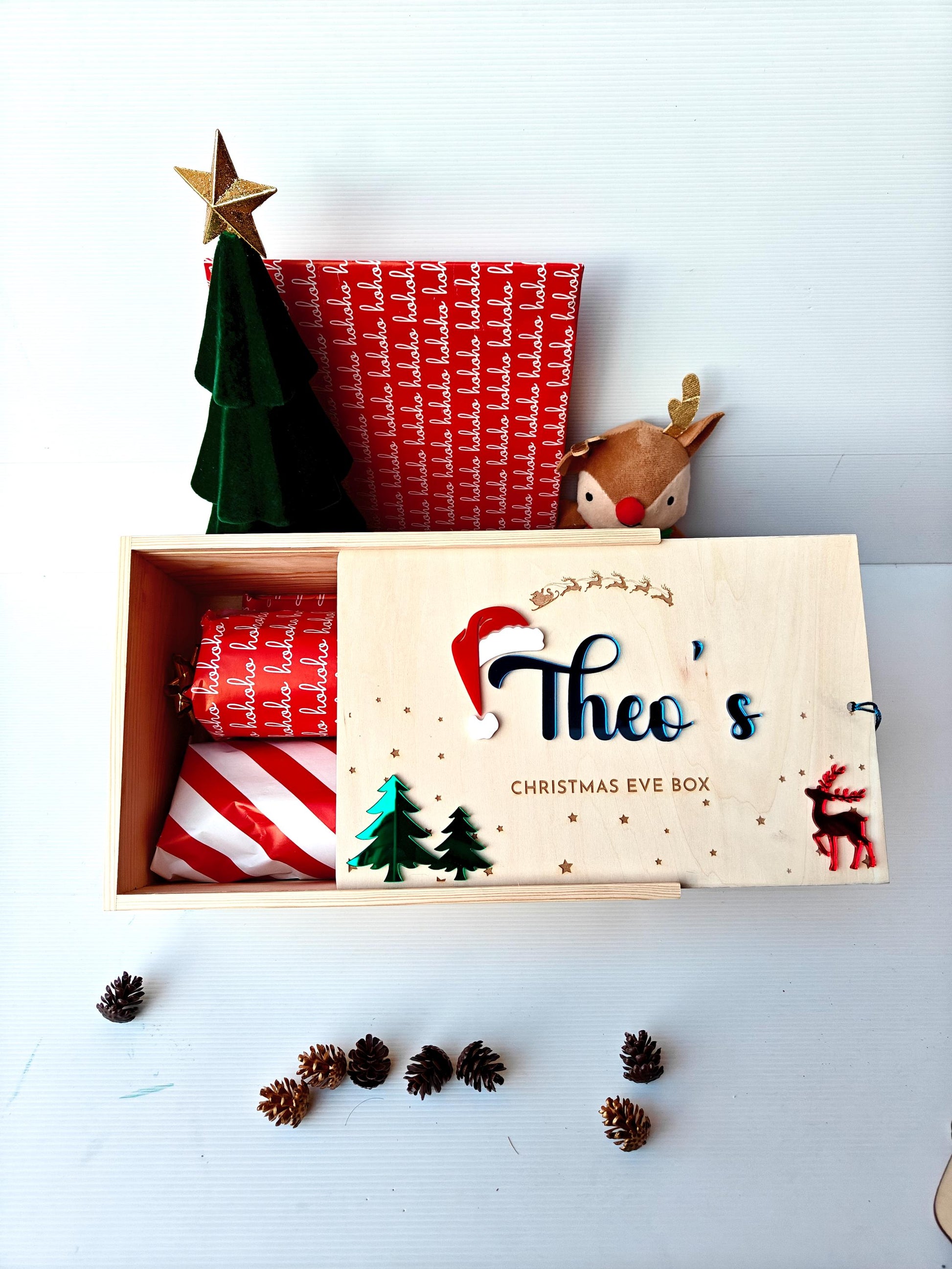 Personalized Christmas Eve box with festive decorations on a white background