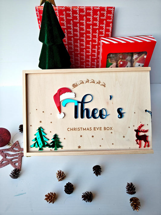 Personalised wooden Christmas Eve box with a family name engraved on the lid.