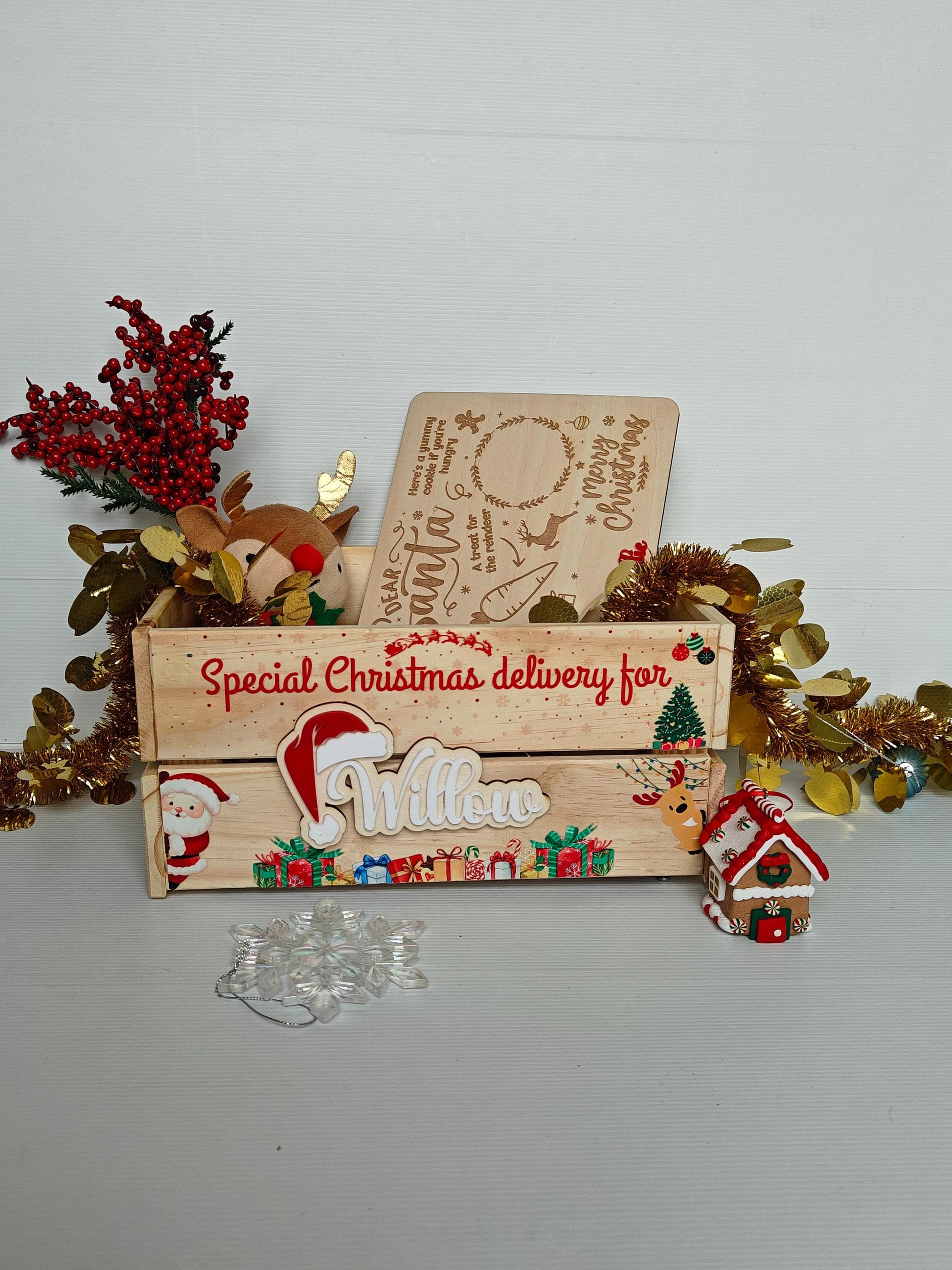 Wooden Christmas box with decorative elements on a light gray background
